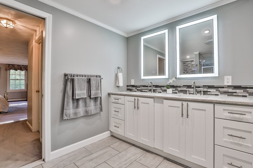 18 Forest Lane Boxford, MA 01921 - Photo 23 of 33 a bathroom with a granite countertop sink and a mirror