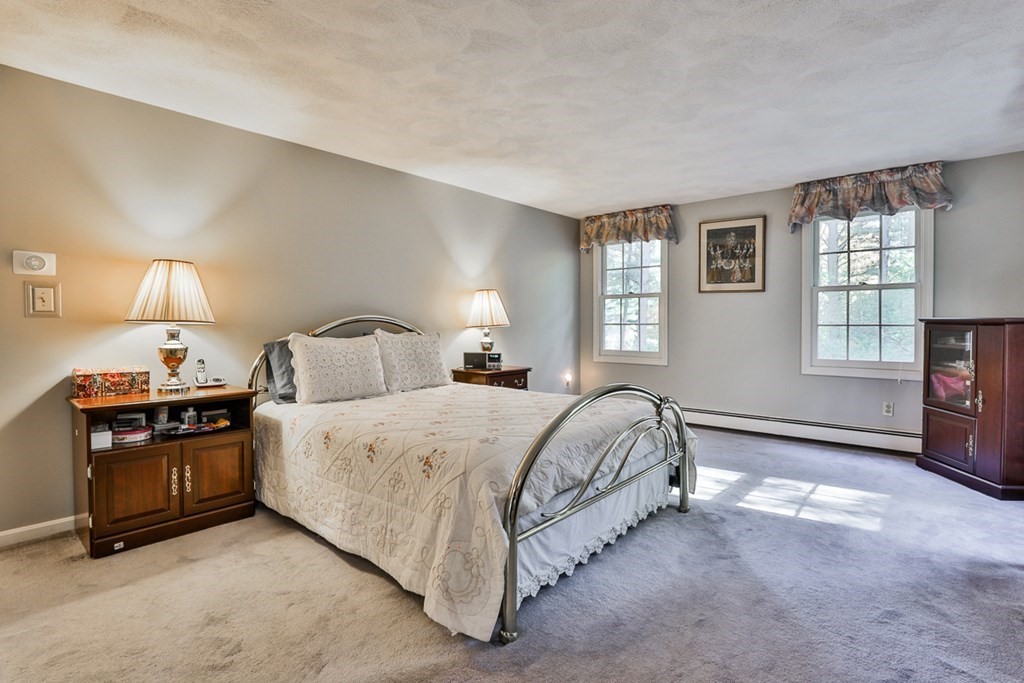 18 Forest Lane Boxford, MA 01921 - Photo 24 of 33 a spacious bedroom with a bed and a window