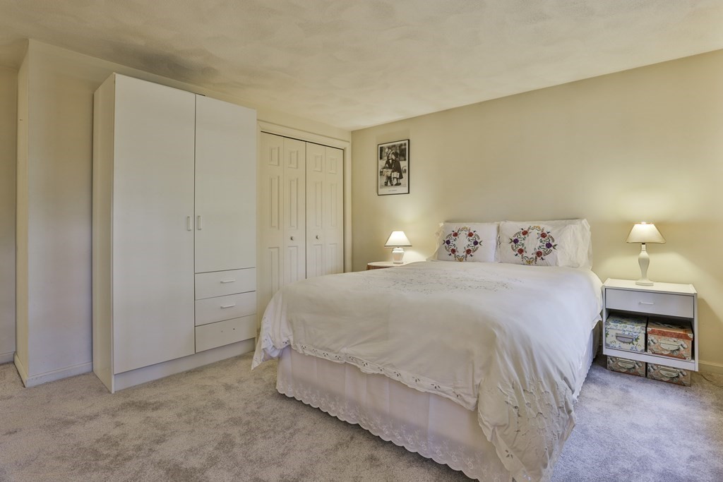 18 Forest Lane Boxford, MA 01921 - Photo 29 of 33 a bedroom with a bed and a night stand