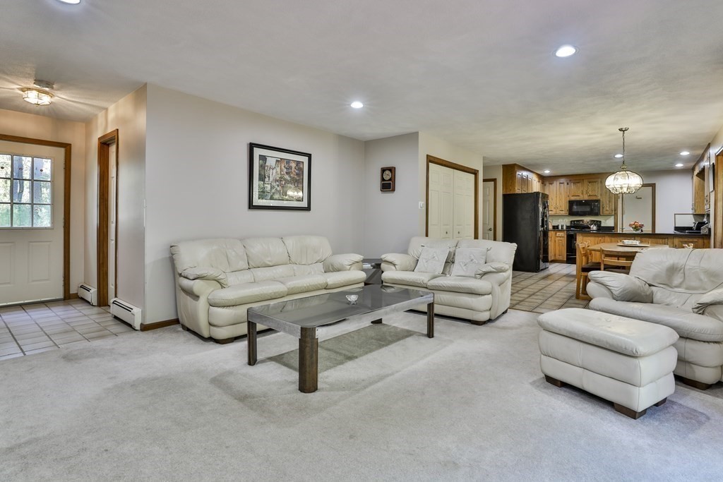 18 Forest Lane Boxford, MA 01921 - Photo 5 of 33 a living room with furniture and a table
