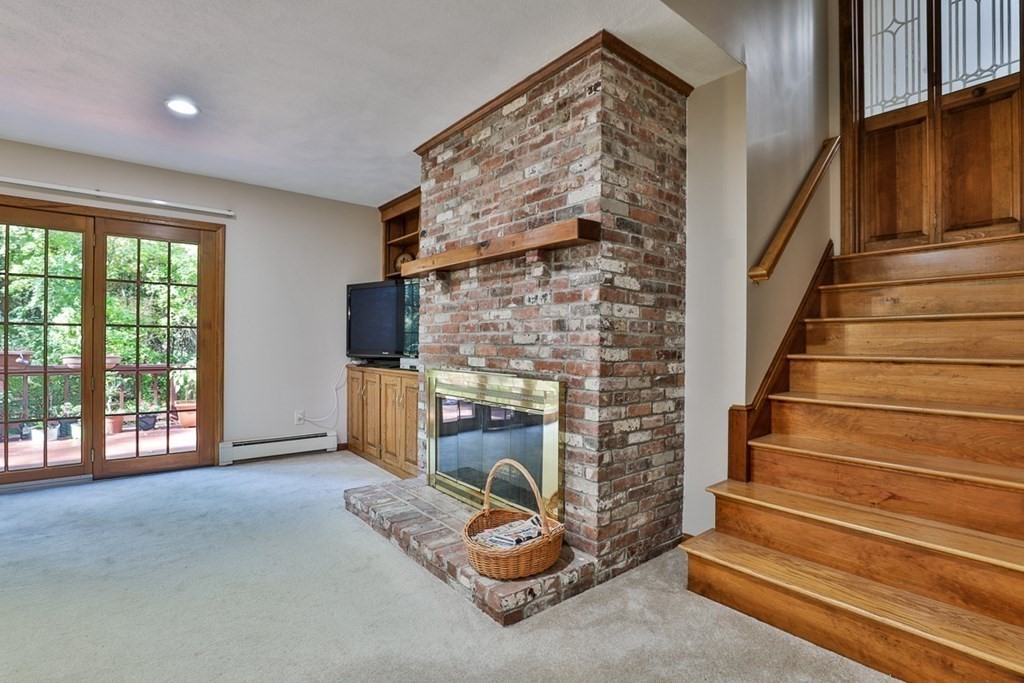 18 Forest Lane Boxford, MA 01921 - Photo 7 of 33 a living room with furniture and a fireplace