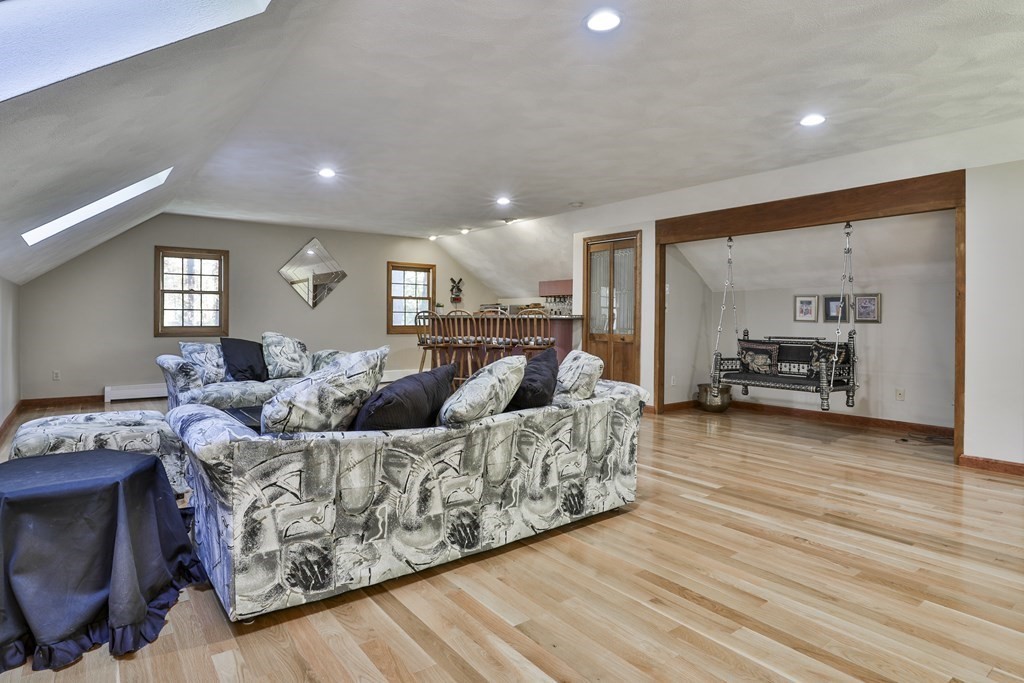 18 Forest Lane Boxford, MA 01921 - Photo 10 of 33 a living room with furniture and a wooden floor