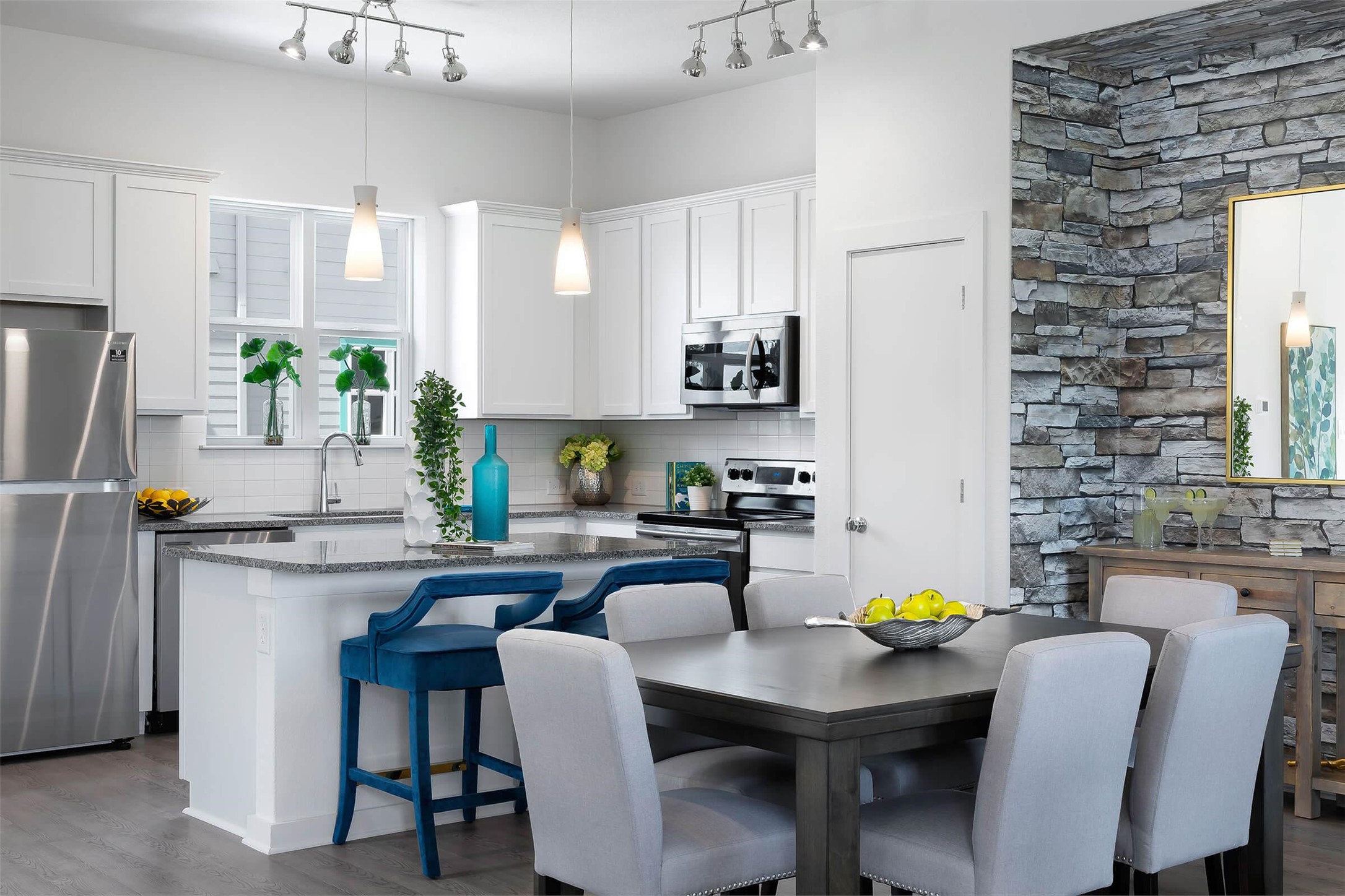 433 Leo Lane Leander, TX 78641 - Photo 5 of 21 Kitchen featuring stainless steel appliances, a breakfast bar area, pendant lighting, and a kitchen island