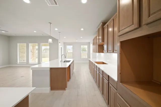 a view of a kitchen with a sink and cabinets