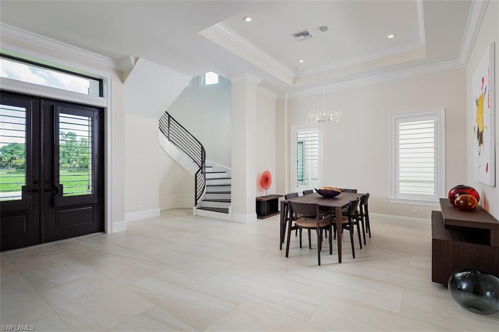 2879 Coco Lakes Drive Naples, FL 34105 - Photo 2 of 30 a view of a livingroom with furniture and window