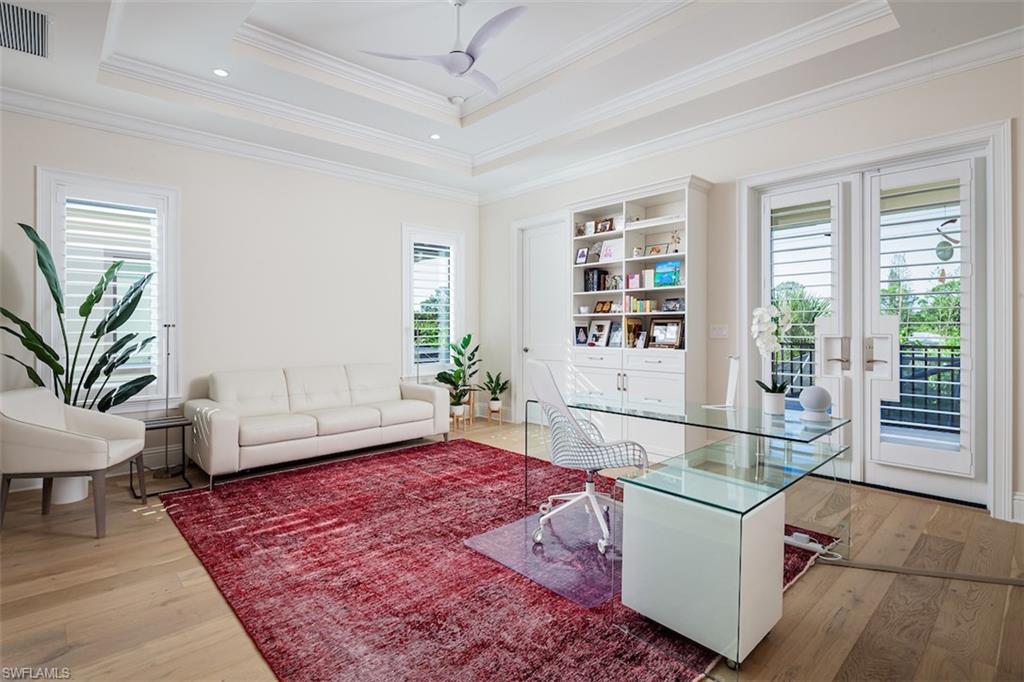 2879 Coco Lakes Drive Naples, FL 34105 - Photo 21 of 30 a living room with furniture and a rug