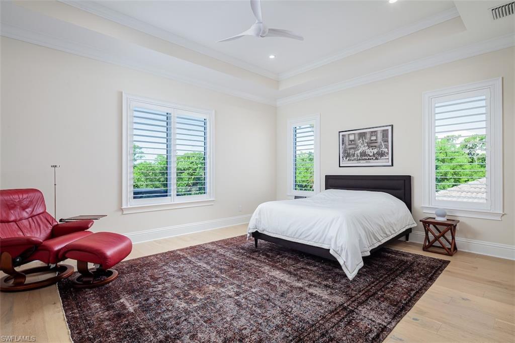 2879 Coco Lakes Drive Naples, FL 34105 - Photo 24 of 30 a bedroom with a bed and window