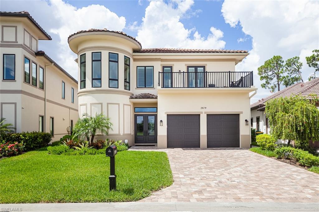 2879 Coco Lakes Drive Naples, FL 34105 - Photo 30 of 30 a front view of a house with garden