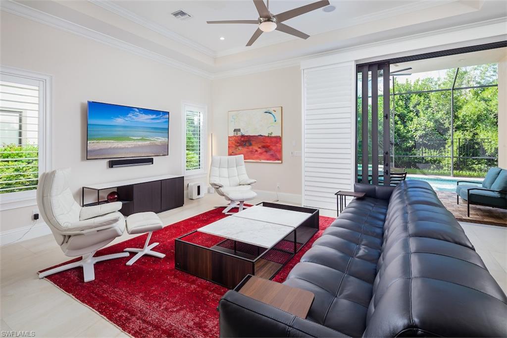 2879 Coco Lakes Drive Naples, FL 34105 - Photo 3 of 30 a living room with furniture and a large window