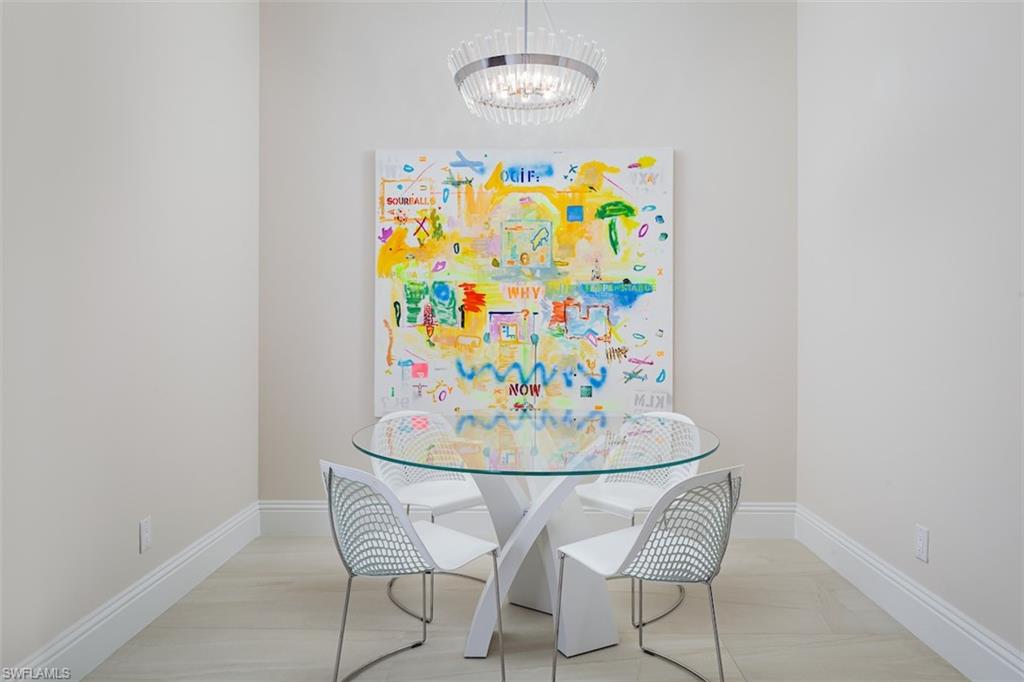 2879 Coco Lakes Drive Naples, FL 34105 - Photo 6 of 30 a dining room with furniture and wooden floor