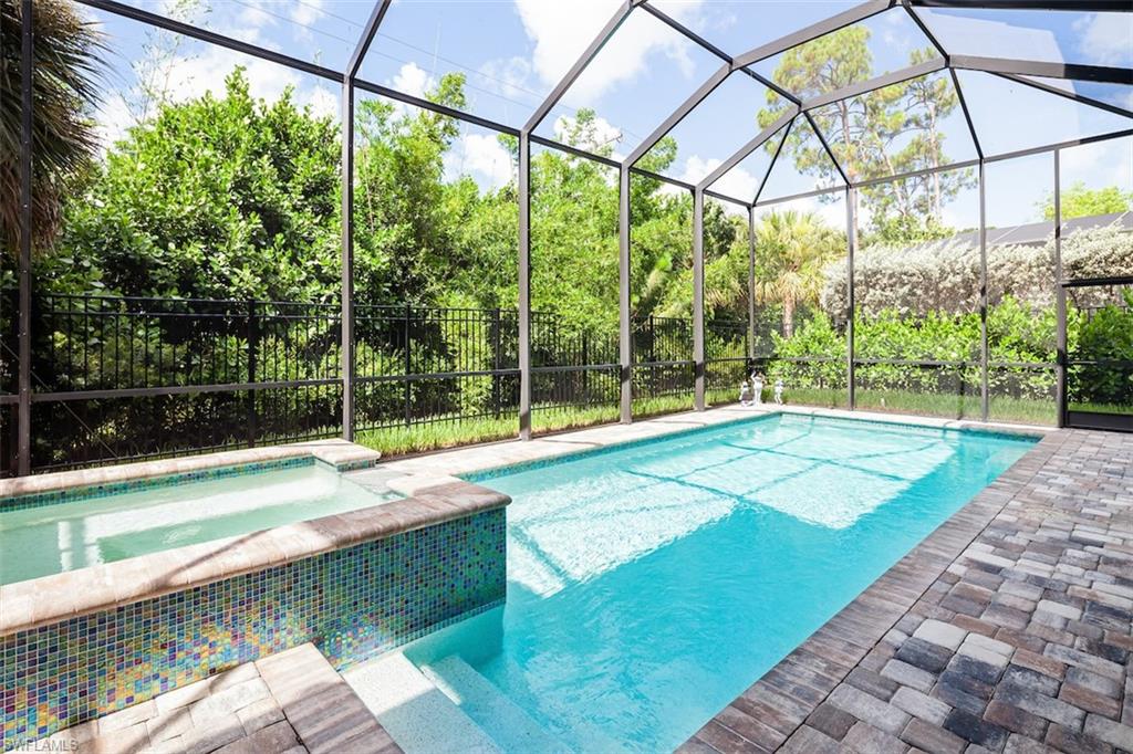 2879 Coco Lakes Drive Naples, FL 34105 - Photo 8 of 30 a view of a backyard with a garden and plants