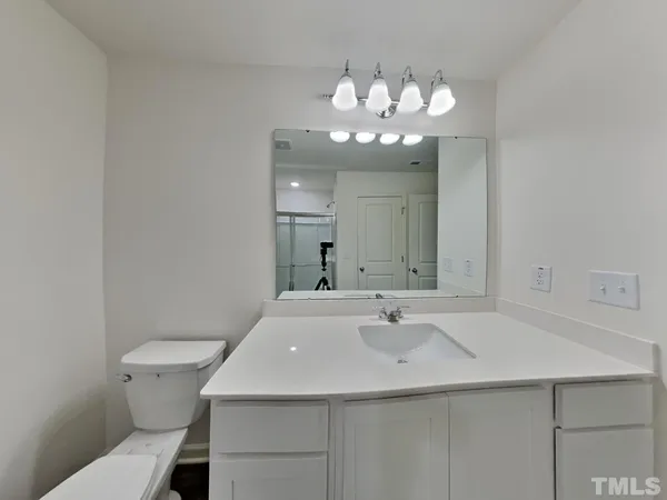 a view of an empty room and a window