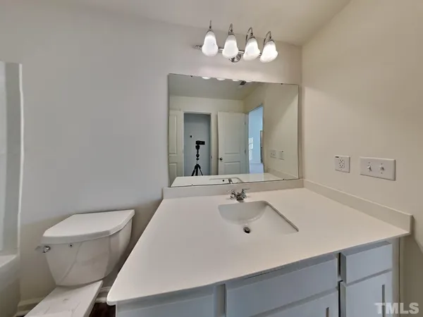 a bathroom with a bathtub and a toilet