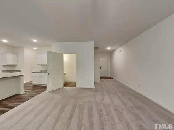 a view of a kitchen with a sink and a refrigerator