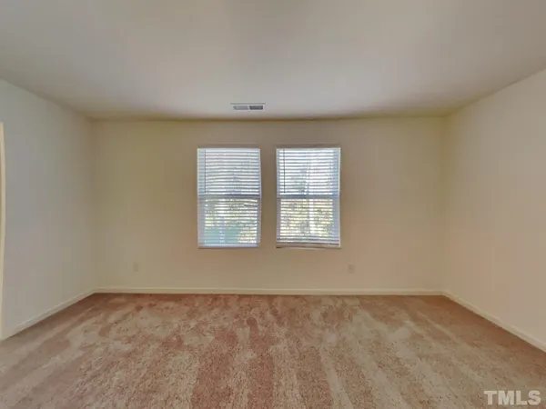 a bathroom with a glass shower door and a sink