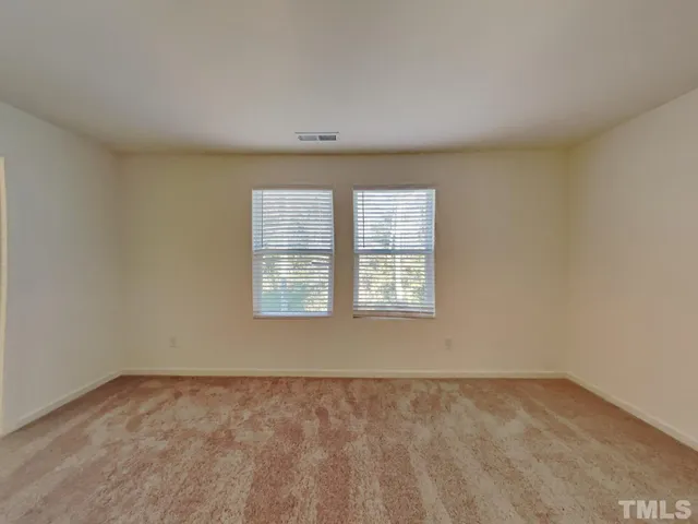 a bathroom with a glass shower door and a sink