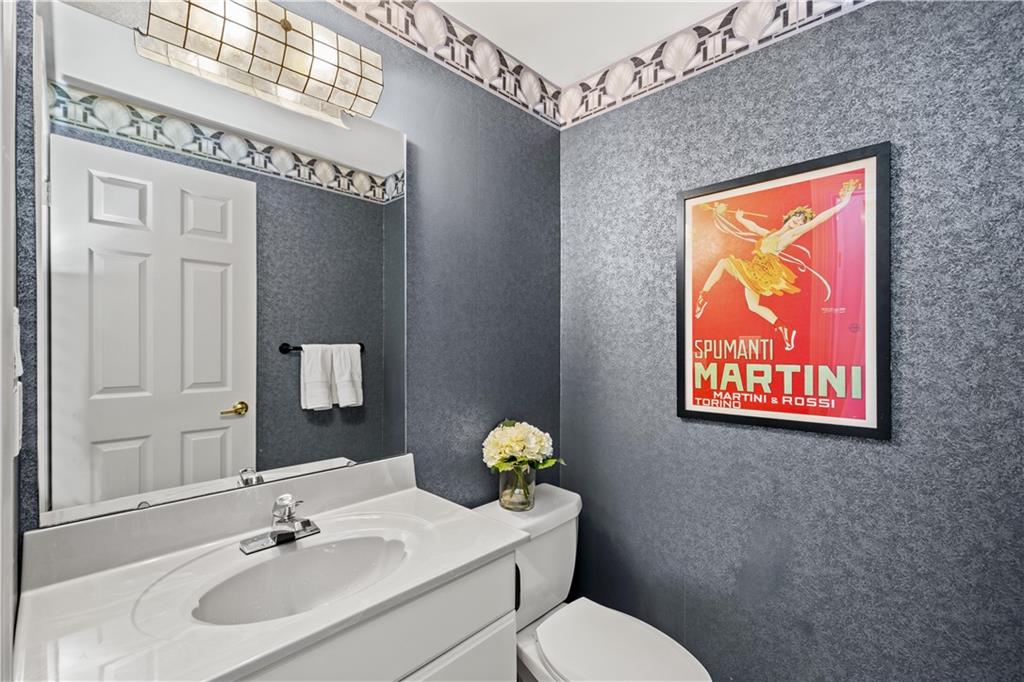 204 Timber Lane Sewickley, PA 15143 - Photo 14 of 25 a bathroom with a toilet sink and mirror