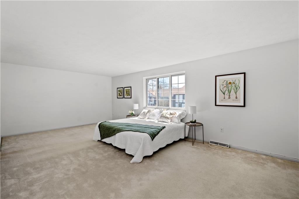204 Timber Lane Sewickley, PA 15143 - Photo 16 of 25 a spacious bedroom with a bed and a couch