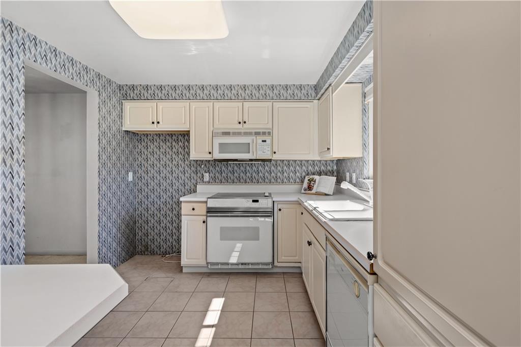 204 Timber Lane Sewickley, PA 15143 - Photo 8 of 25 a kitchen with a sink stove and cabinets
