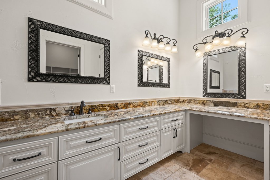102 Long Point Cove Georgetown, TX 78628 - Photo 22 of 36 a bathroom with a toilet sink and mirror