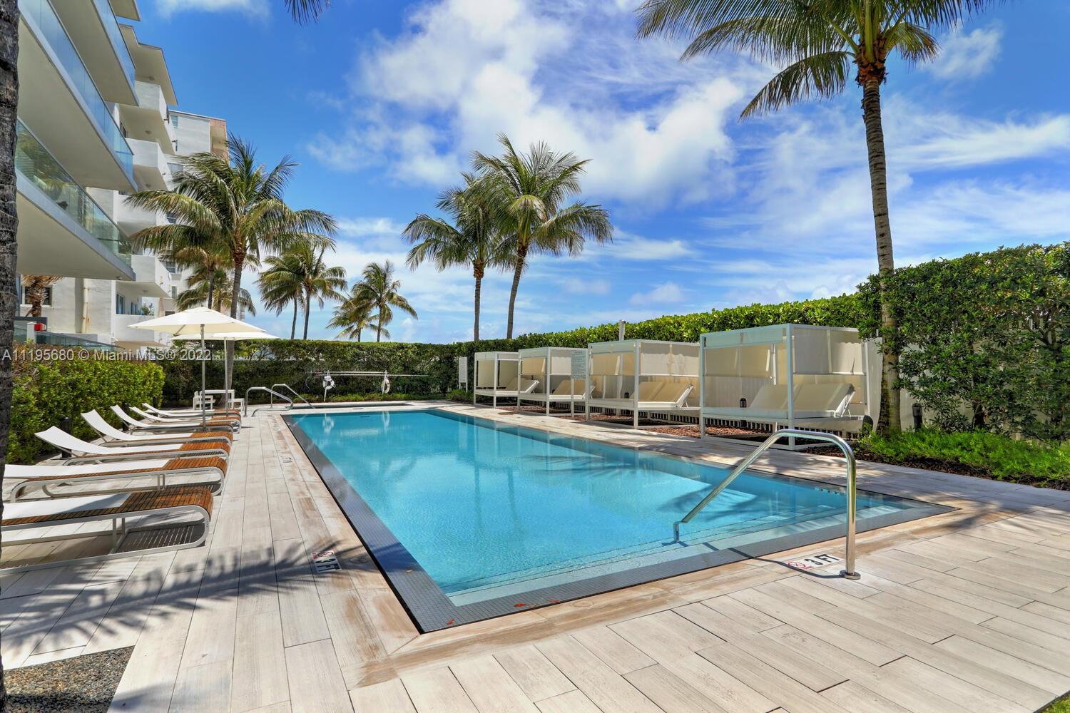 a view of swimming pool with chairs