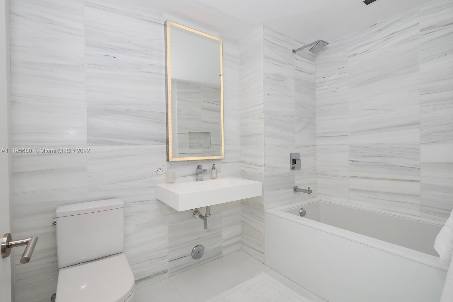 Miami Beach Miami Beach, FL 33139 - Photo 19 of 27 a bathroom with a sink toilet and shower