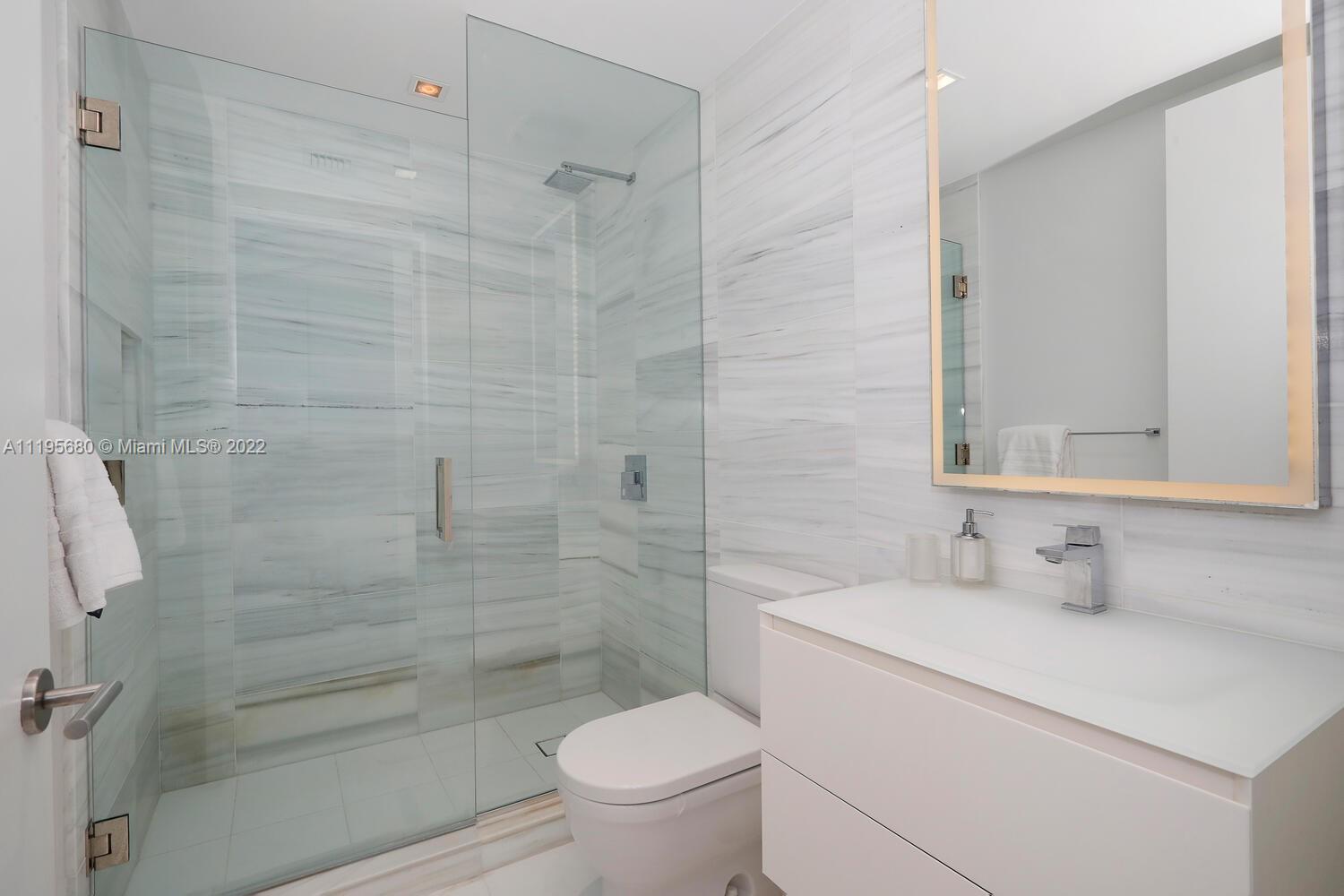 Miami Beach Miami Beach, FL 33139 - Photo 21 of 27 a bathroom with a sink a toilet and shower