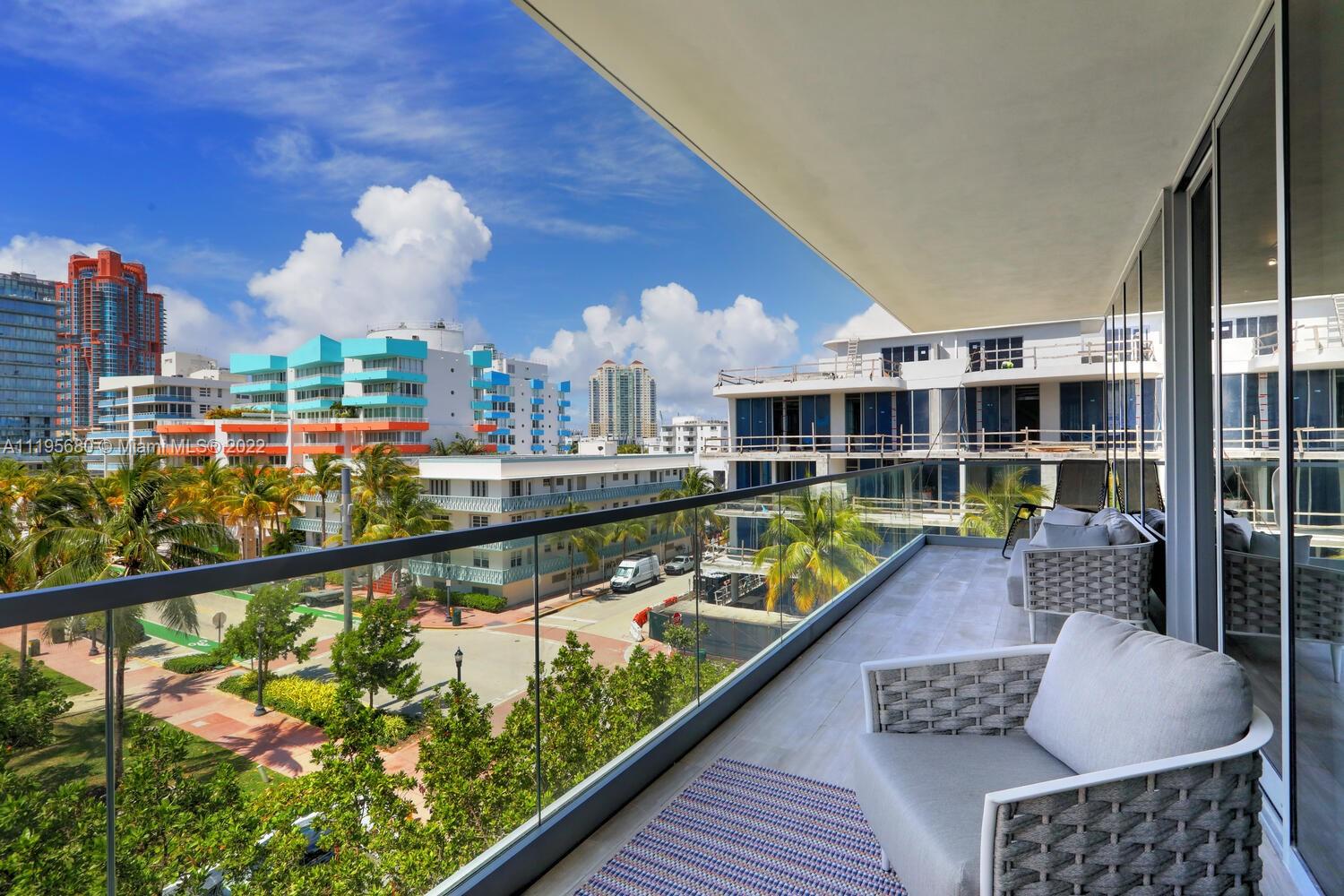 Miami Beach Miami Beach, FL 33139 - Photo 7 of 27 a view of a chairs and table in a balcony