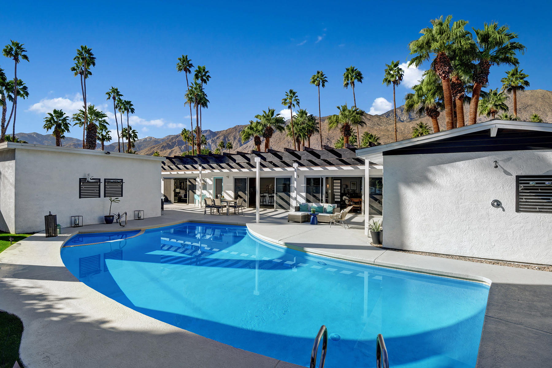 4 Palomino Road Palm Springs, CA 92264 - Photo 3 of 34 POOL TO HOUSE AND MOUNTAINS PULLED BACK
