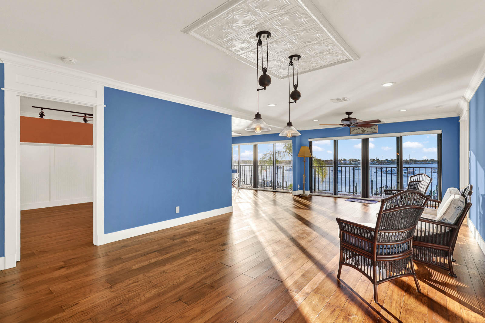 624 Southwest St Lucie Crescent, Unit 306 Stuart, FL 34994 - Photo 16 of 49 a view of a livingroom with furniture wooden floor and chandelier