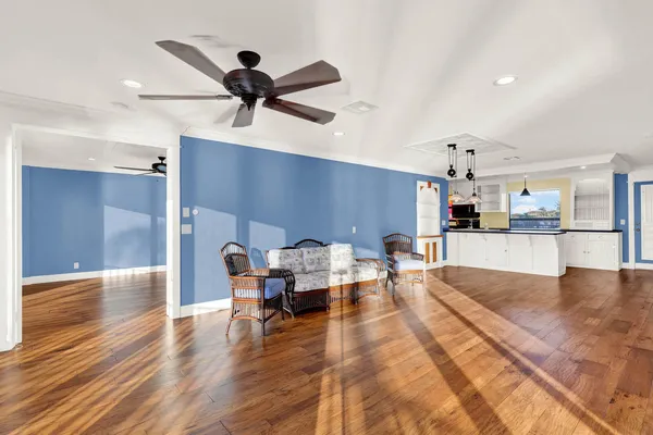 a view of a room with wooden floor
