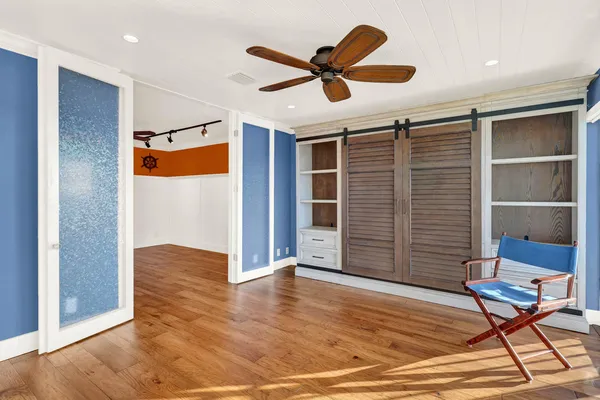 a view of a livingroom with wooden floor