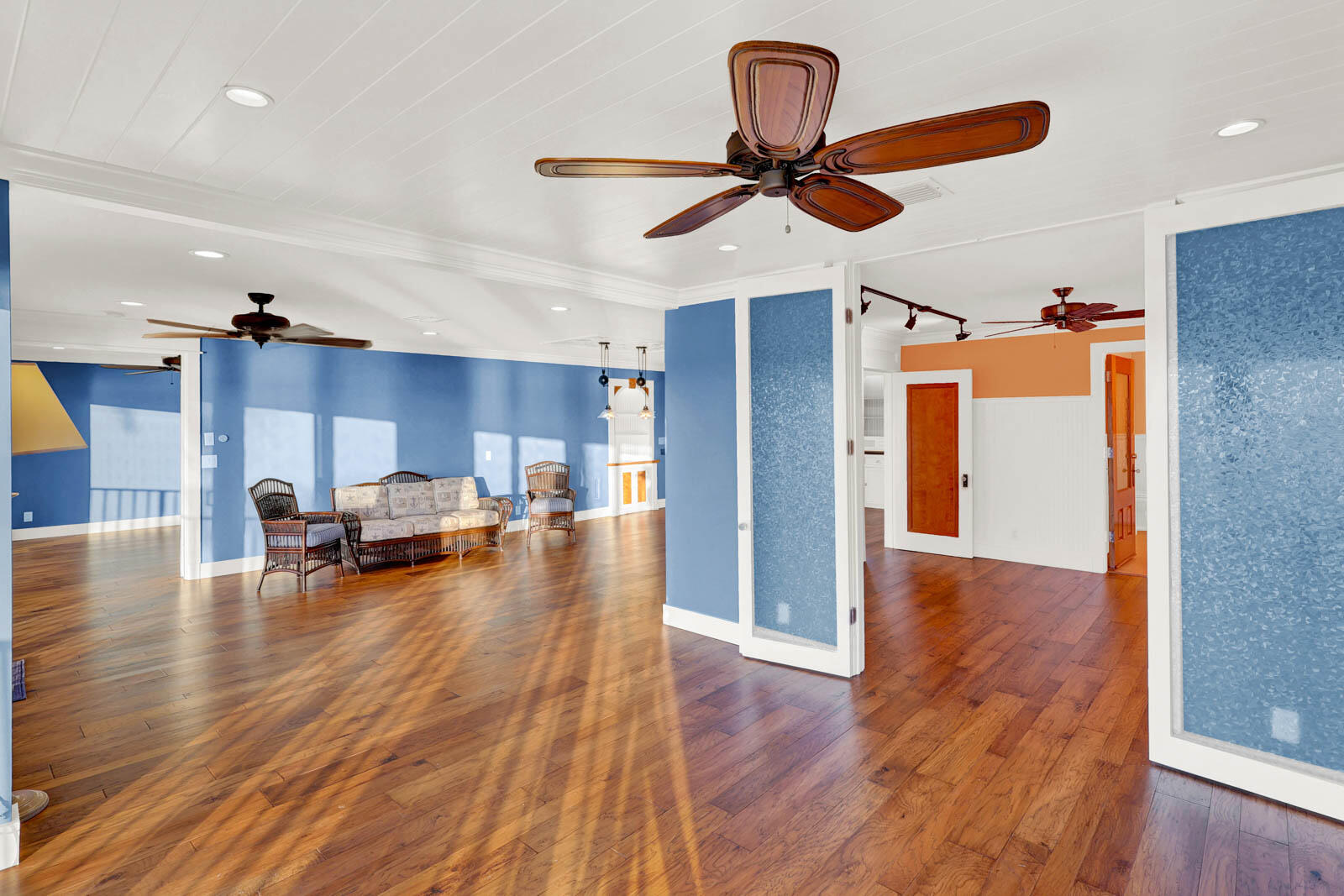 624 Southwest St Lucie Crescent, Unit 306 Stuart, FL 34994 - Photo 22 of 49 a view of a room with wooden floor and a ceiling fan