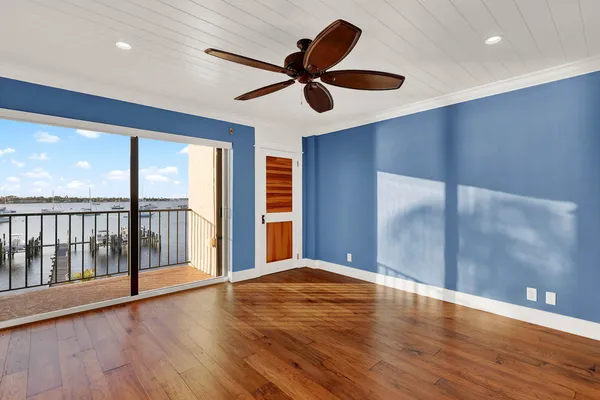 a view of a swimming pool with a patio and garden