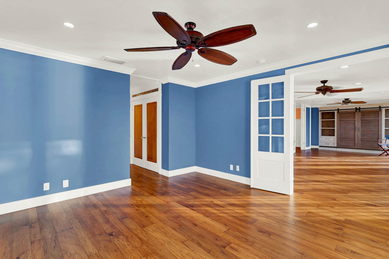624 Southwest St Lucie Crescent, Unit 306 Stuart, FL 34994 - Photo 32 of 49 a view of an empty room with wooden floor and a window