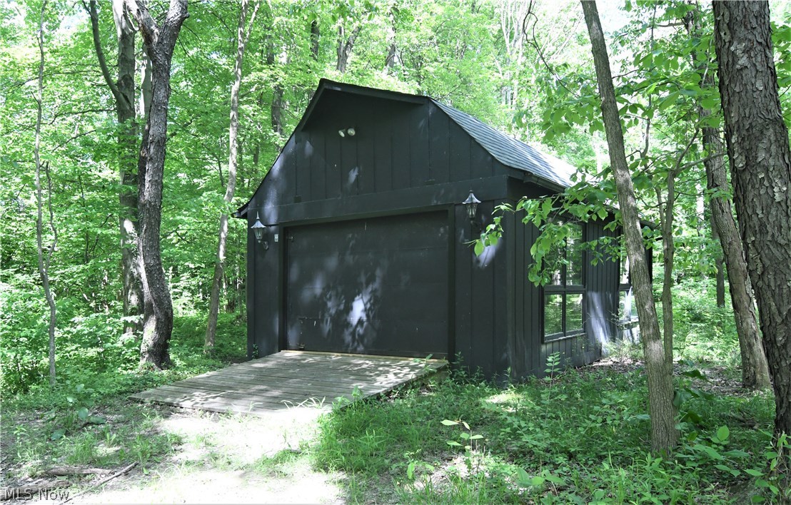 1271 Sand Run Road Akron, OH 44313 - Photo 28 of 32 Large outbuilding with overhead door, wood floors, and electric.