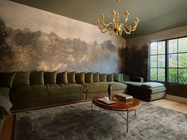 a living room with furniture and a chandelier