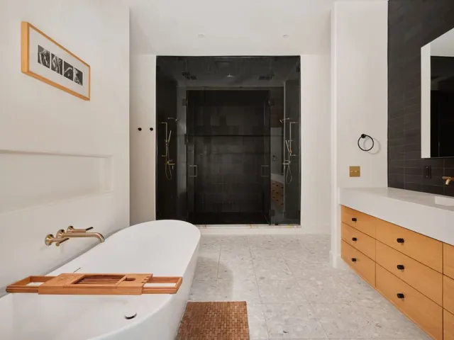 a bathroom with a tub and a sink