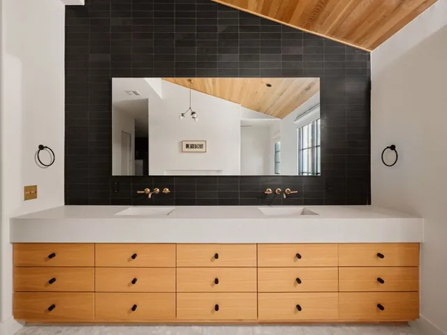 a large kitchen with wooden floor