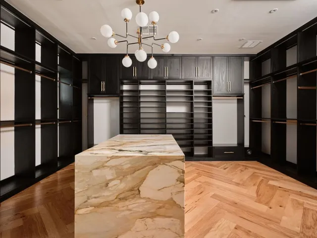 a bathroom with a double vanity sink mirror and shower