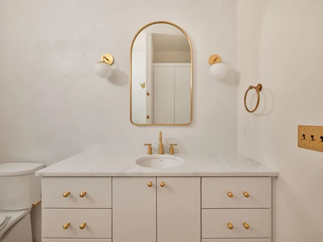 a view of a house with pool and chairs