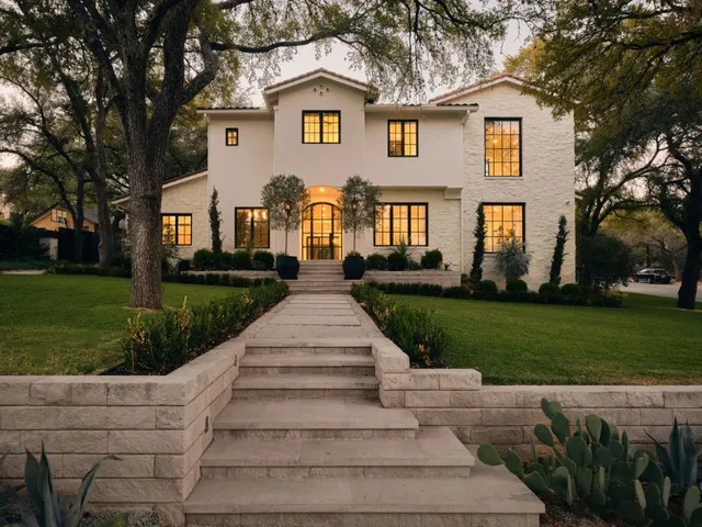 a front view of a house with garden