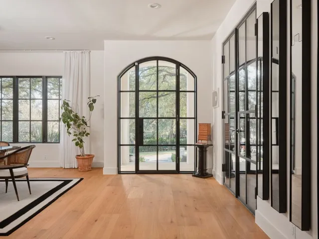 a view of an entryway with a floor to ceiling window