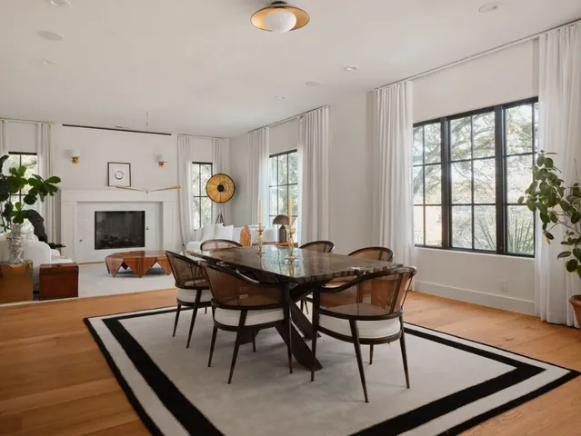 a view of a livingroom with furniture and a fireplace