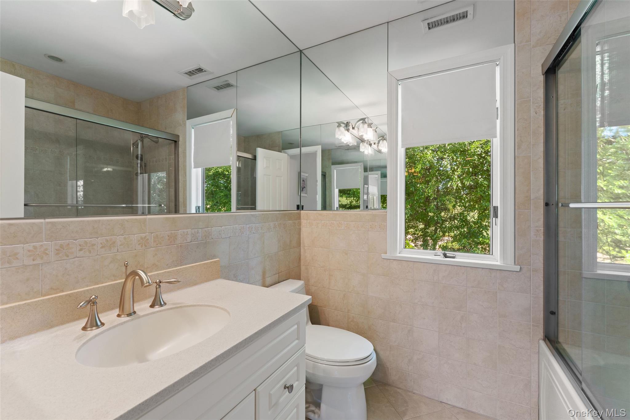6 Magnetti Circle Mamaroneck, NY 10543 - Photo 17 of 24 a bathroom with a sink toilet and shower