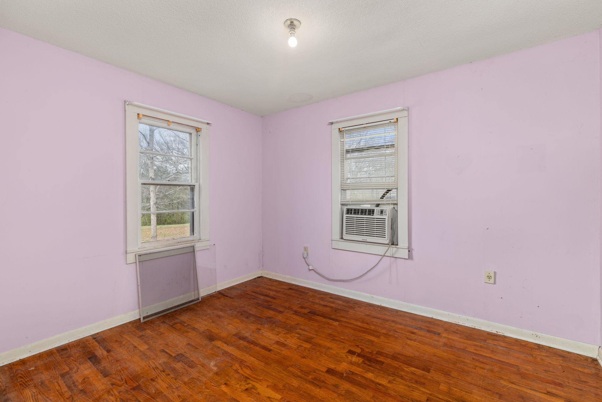 11051 Highway 64 Lexington, AL 35648 - Photo 13 of 44 a view of a room with wooden floor and windows