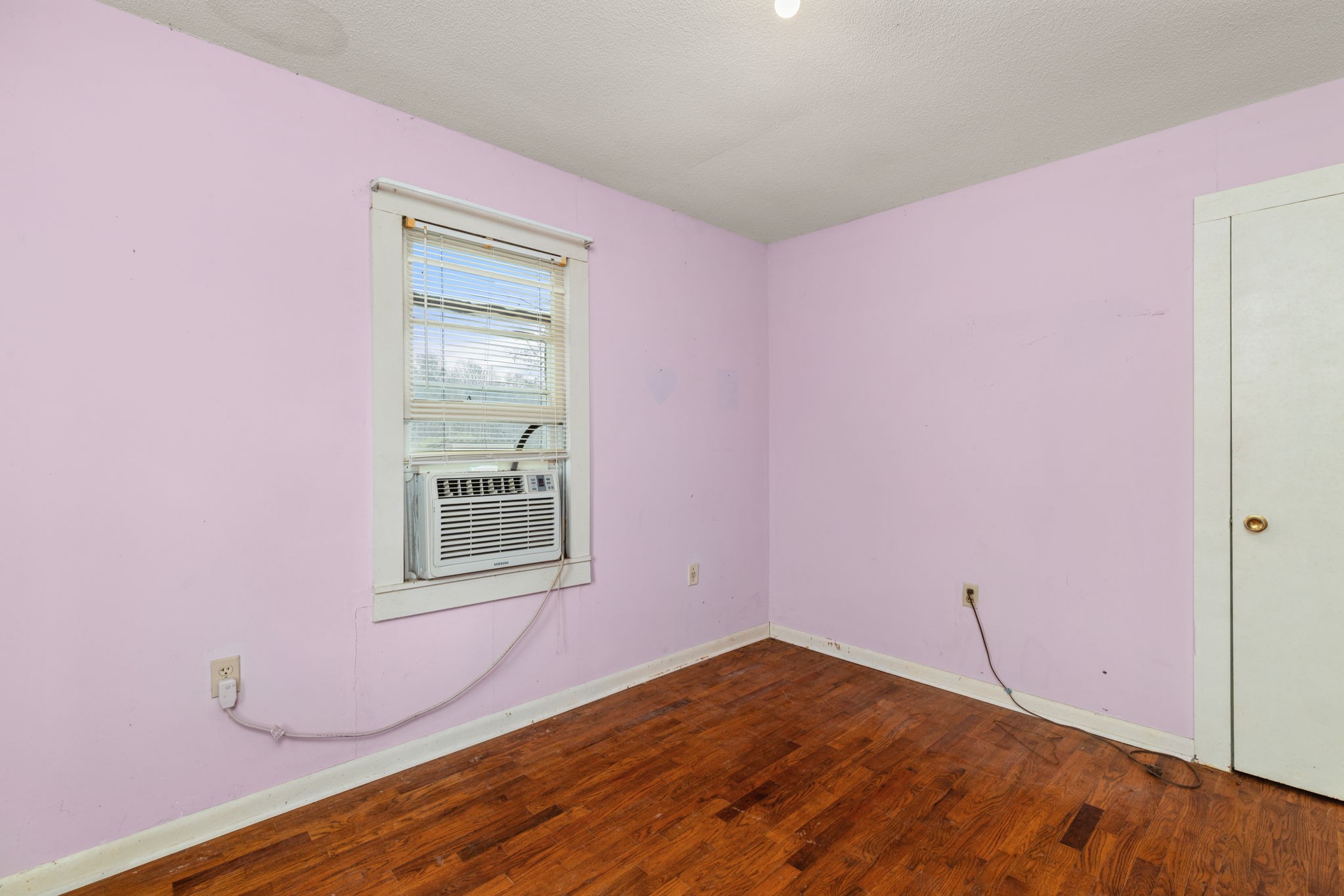 11051 Highway 64 Lexington, AL 35648 - Photo 14 of 44 a view of empty room with wooden floor and fan