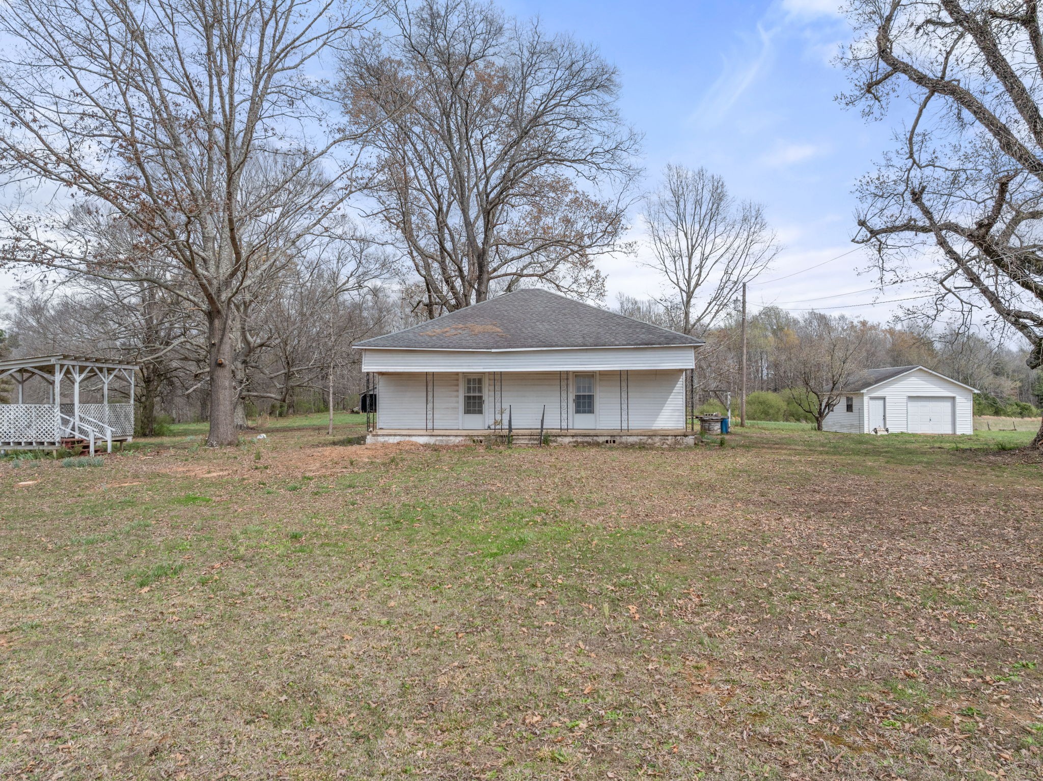 11051 Highway 64 Lexington, AL 35648 - Photo 2 of 44 a front view of a house with a yard and trees