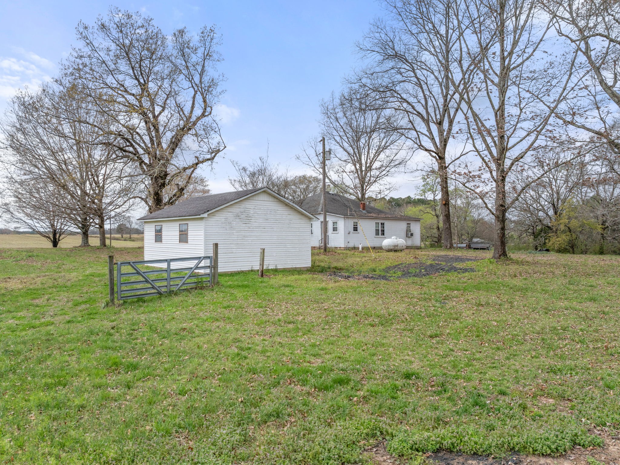 11051 Highway 64 Lexington, AL 35648 - Photo 28 of 44 a house with huge green field in front of it