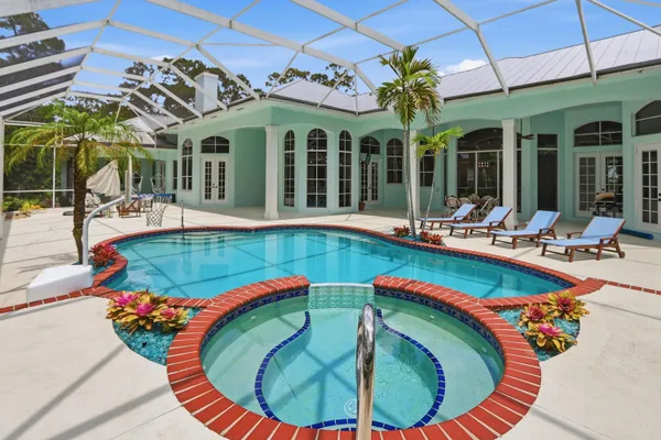 a view of a house with swimming pool